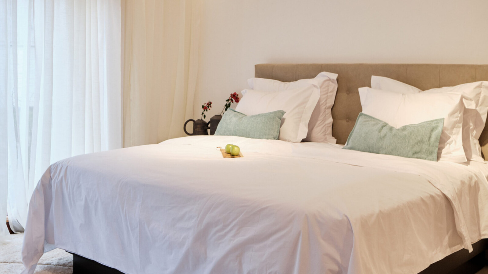 A Wood Habitat bedroom, handmade in Kigali